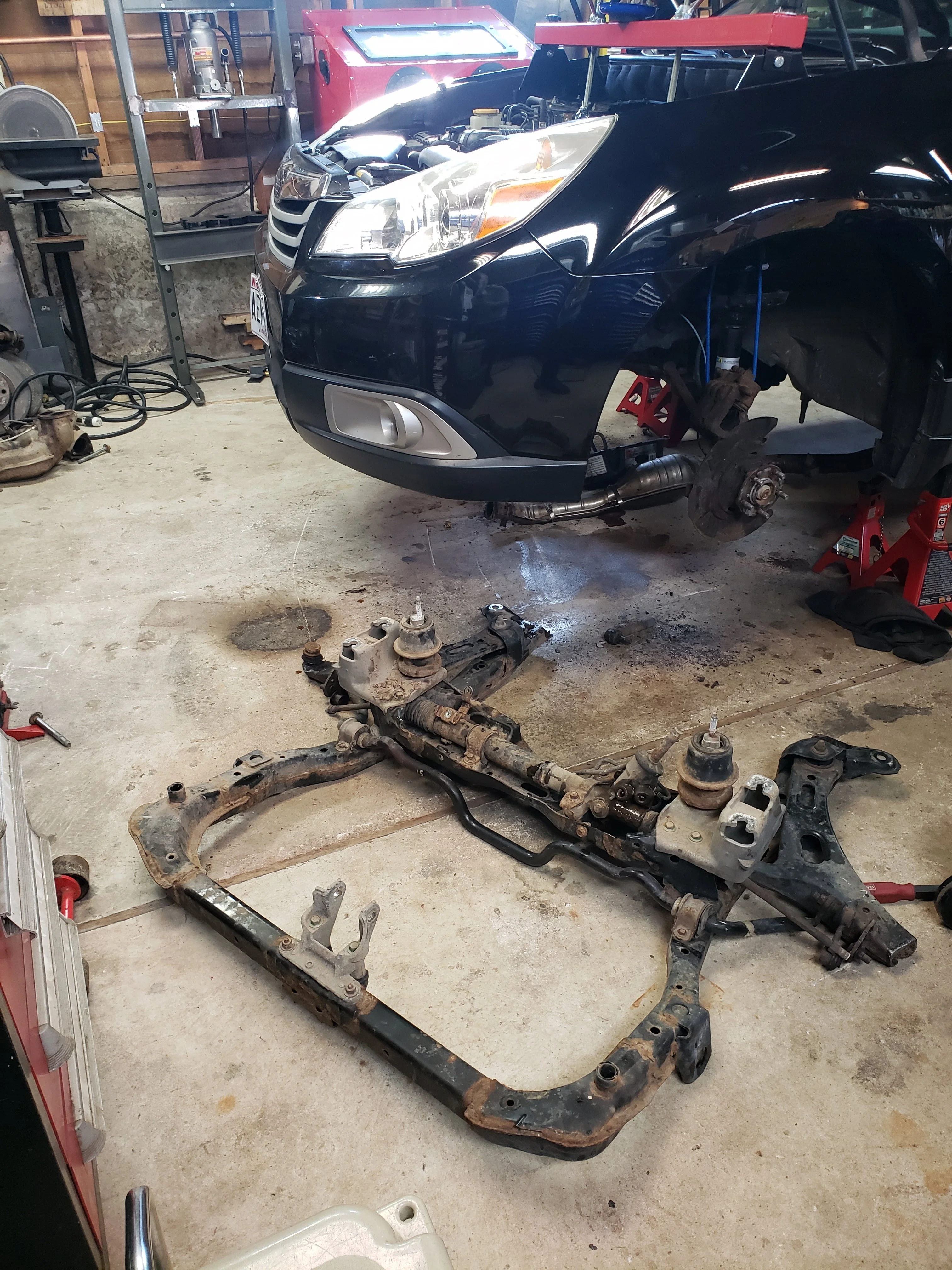 Subaru subframe removed showing structural damage